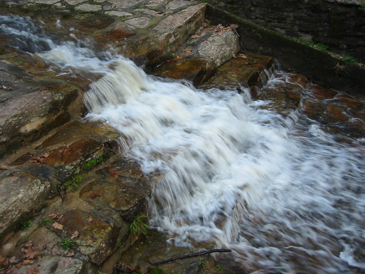 Water flowing over stone steps