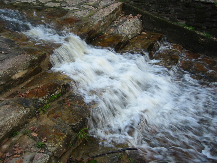 Water flowing over stone steps