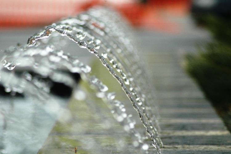 A line of water arcs, with one in focus