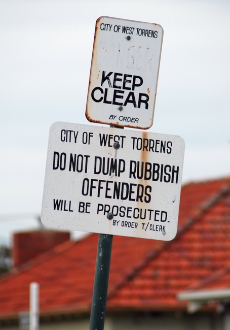 A sign reading 'Do not dump rubbish offenders'