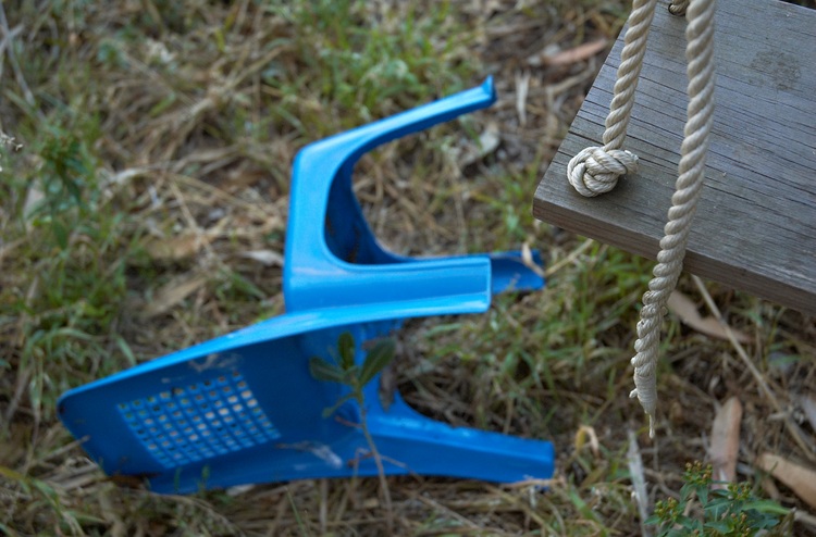 A tree swing and a kid's chair