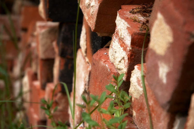 Closeup of a stack of old red bricks