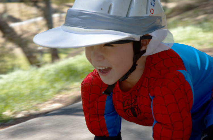 Closeup of Michael's face as he travels down the slope on his skateboard