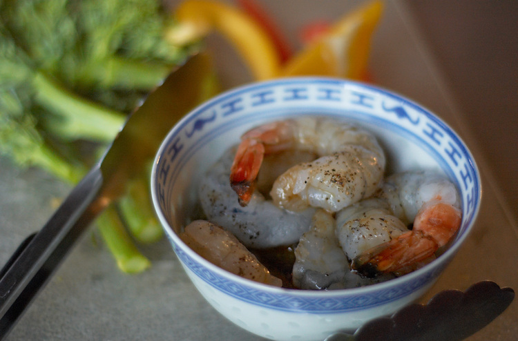 A bowl of uncooked prawns
