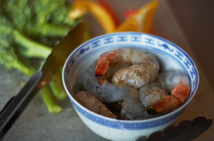 A bowl of uncooked prawns