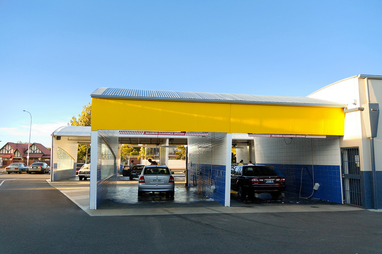 People hand-washing their cars