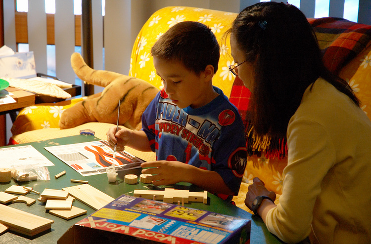 Michael and Theen building a wooded model truck