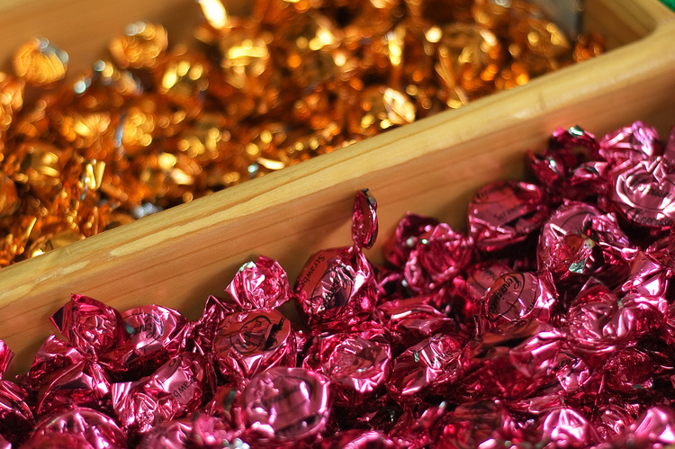 A sea of sweets, divided by wooden boxes