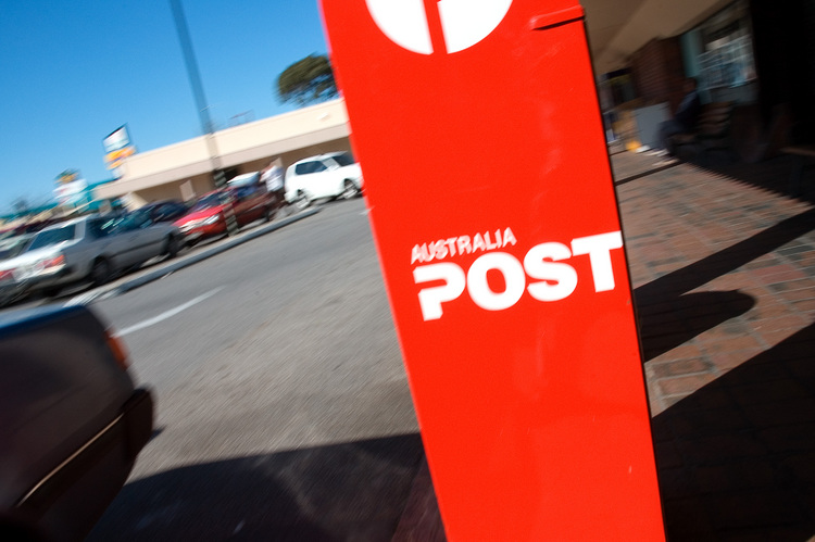 Motion blurred photo of a red post-box