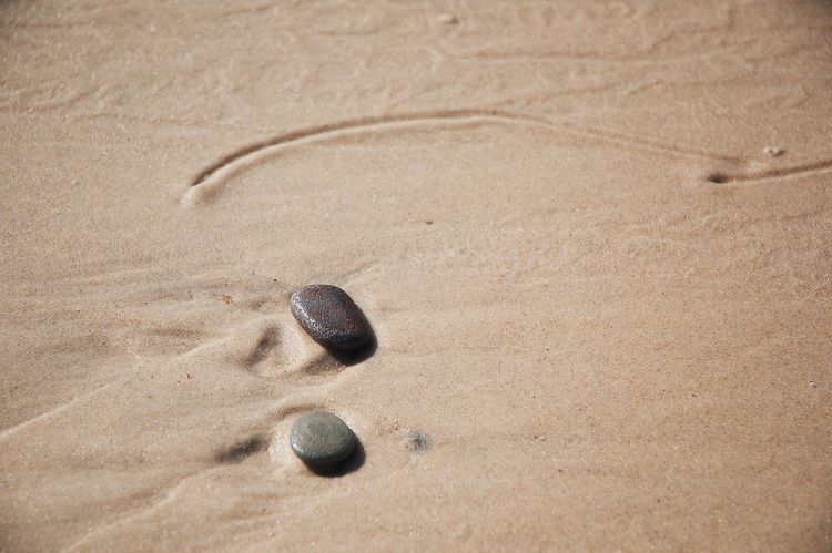 Pebbles on wet sand