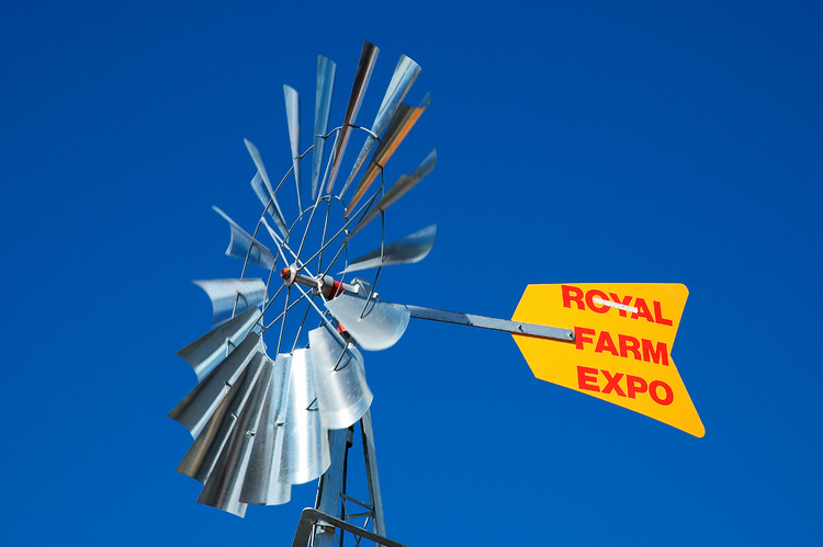 A steel windmill, against a blue sky