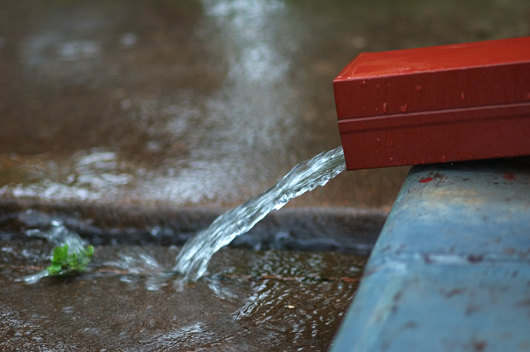 Water gushing from a downpipe