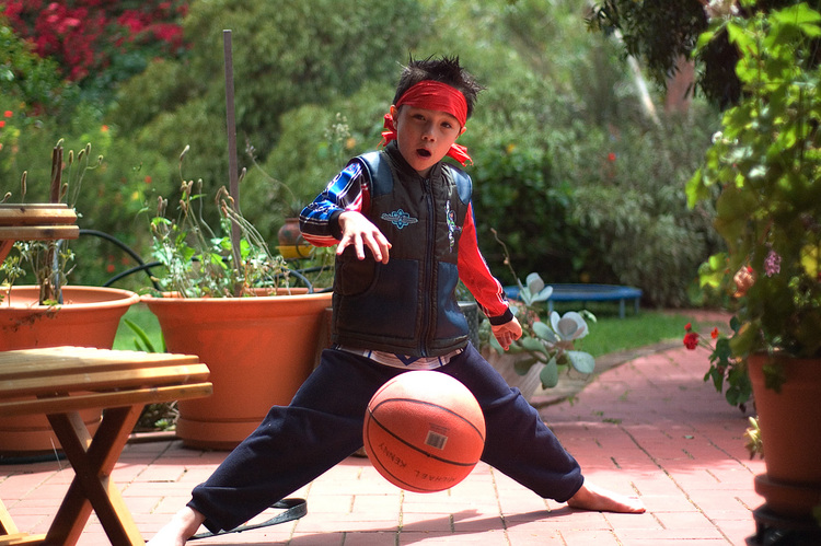 Michael bouncing a basketball