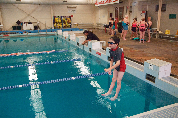 Michael, jumping into a swimming pool