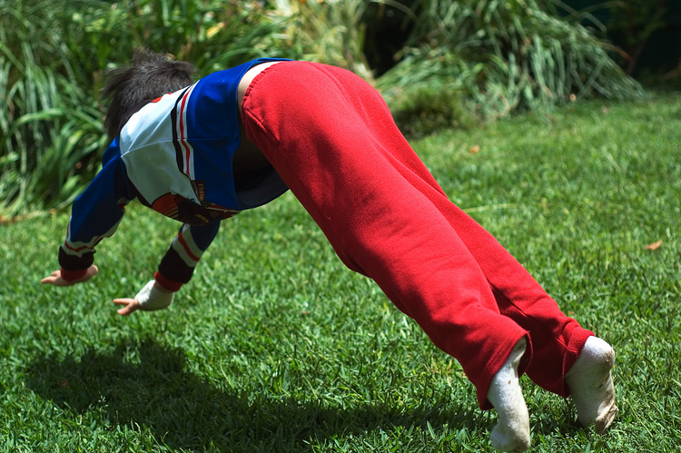 Michael leaping across the lawn