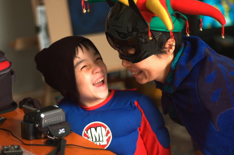 Michael and Theen watching the LCD monitor of a camcorder