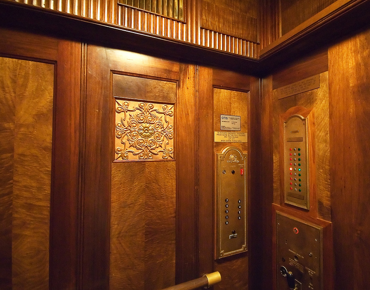 The wood panelled interior of 1930's lift