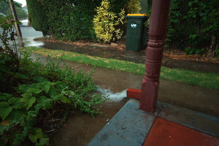 Water gushing from a downpipe