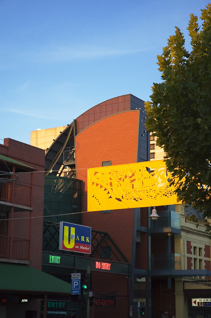 The lift building of the Adelaide Central Market, lit by early evening sun