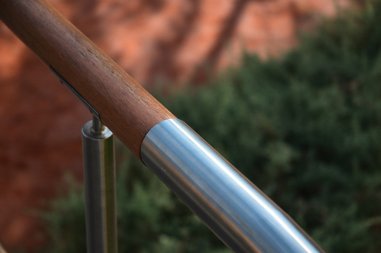 Closeup of a wood and metal handrail