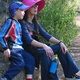 Michael and Theen rest on a rock