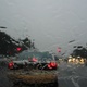 Car lights seen through a rainy windscreen