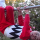 Michael hangs from a monkey bar