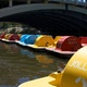 Colourful paddle-boats moored on the river