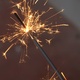 A closeup of a sparkler burning