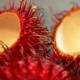 Rambutan fruit, whole and halved