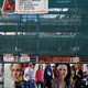 People pass by a demolition site in Rundle Mall