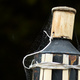 Fine spider webs on an outdoor oil lamp