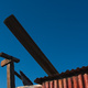 Corrugated iron, against a blue sky