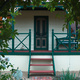 Looking through the rose arch at Meander Cottage