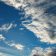 An aircraft silhouetted against clouds and sunset