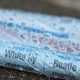 Closeup of a newspaper wrapped in wet plastic