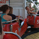 Waiting in roller-coaster cars for the ride to begin