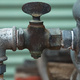 The tap on the side of a rainwater tank