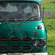 An old van abandoned in the corner of a paddock