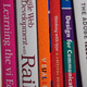 The spines of a number of books