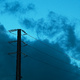 Power lines against an early evening sky