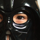 Closeup of Michael's eyes seen through a Darth Vader mask