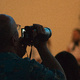 A man recording a school concert