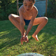 Michael posing as Spider-Man, while jumping on a trampoline