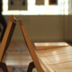 An end-on view of a pair of wooden benches