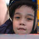 Michael hanging from playground equipment