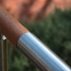 Closeup of a wood and metal handrail