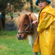 Michael leading a miniature horse