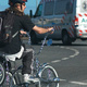 A man on a bicycle finished in chrome, and with white-walled tyres